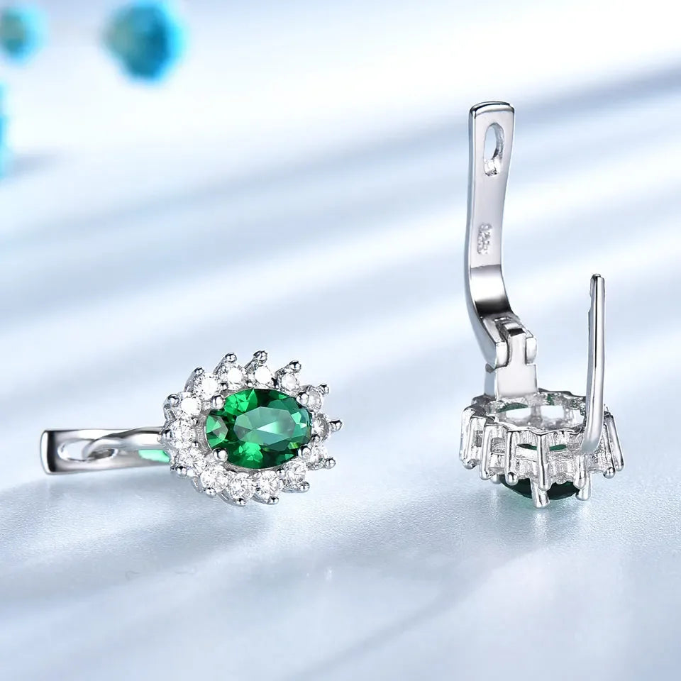 RadiantEmerald™ – 5*7mm Oval Clip Earrings with Emerald and Flower Design
