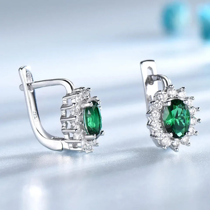 RadiantEmerald™ – 5*7mm Oval Clip Earrings with Emerald and Flower Design